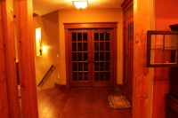French double doors with red oak casing and header
