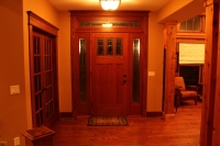 Entry door with red oak trim and header