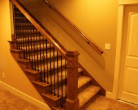 Red oak staircase with box newel and iron balusters