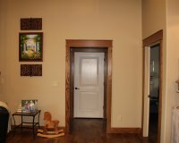 Knotty alder entry door with red oak box newel
