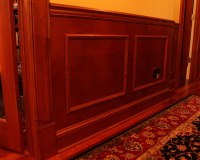 Custom maple wainscoting, chair rail, and maple casing with plinth block