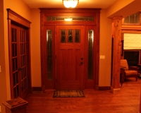 Entry door with red oak trim and header