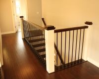 Custom maple newel posts and iron balusters